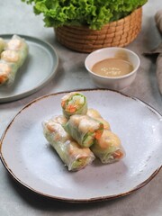 Fresh summer rolls with shrimp and vetgetables,Vietnamese food for healthy food concept with salad dressing
