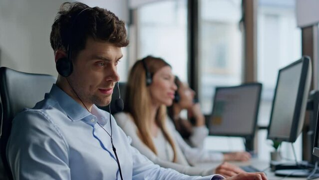 Stressed call center worker speaking headset closeup. Annoyed man specialist