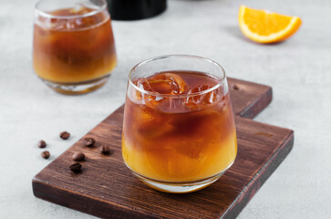 Bumble Coffee, Coffee with Orange Juice with Ice, Refreshing Drink on Grey Background