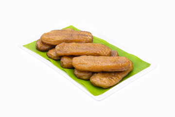 dried bananas in white ceramic plate on white background closeup,isolated