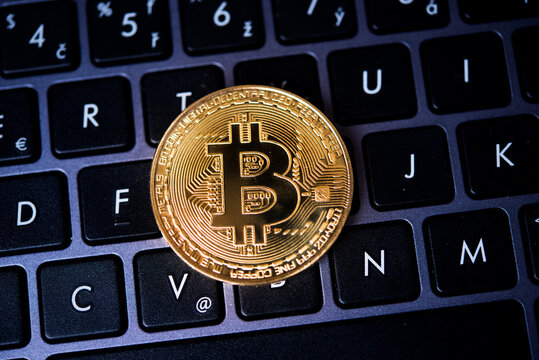 Golden Bitcoin on dark background Close-up, macro shot.  Virtual Money