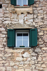 Fototapeta na wymiar Picturesque windows on traditional old Mediterranean house in Split, Croatia.
