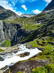 Trollstigen road in summer in Norway. View on mountain and waterfall.