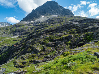 Trollstigen road in summer in Norway. View on mountain and waterfall.
