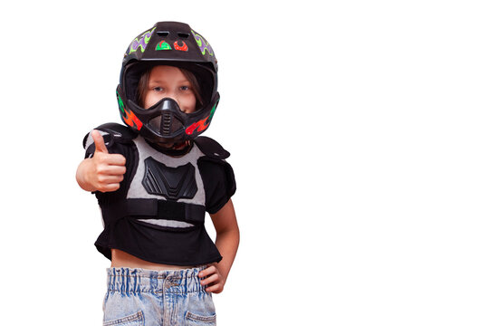 Girl wearing helmet and bib moto gear for motocross standing smiling and showing thumb up photo for advertisement of moto school, motorcycle rental or delivery service on isolated background