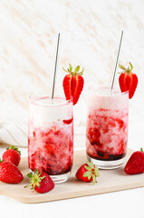 Korean Strawberry Milk, Strawberry Milkshake with Pureed Fresh Berries, Refreshing Drink on Bright Background