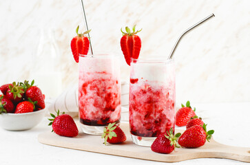Korean Strawberry Milk, Strawberry Milkshake with Pureed Fresh Berries, Refreshing Drink on Bright Background