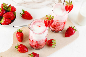 Korean Strawberry Milk, Strawberry Milkshake with Pureed Fresh Berries, Refreshing Drink on Bright Background