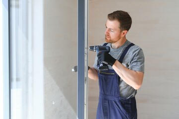 Process of construction new and modern modular house from composite sip panels. Worker man in special protective uniform wear working on building development industry of energy efficient property.