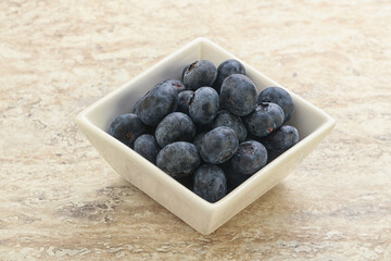 Sweet ripe blueberry heap in the bowl