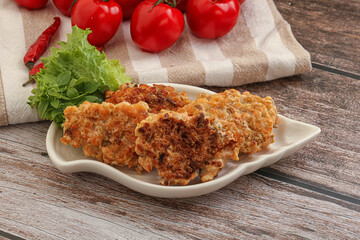 Fried salmonn cutlet in the bowl