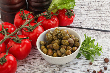 Marinated green capers in the bowl