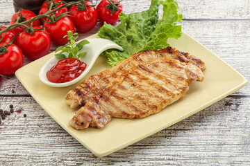 Grilled pork steak with ketchup