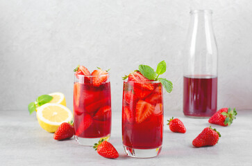 Strawberry Drink, Refreshing Summer Cocktail, Lemonade, Iced Tea, Red Cold Drink on Bright Background