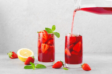 Strawberry Drink, Refreshing Summer Cocktail, Lemonade, Iced Tea, Red Cold Drink on Bright Background