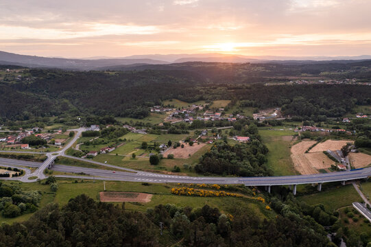 From above drone view of roads with exit points from main highway