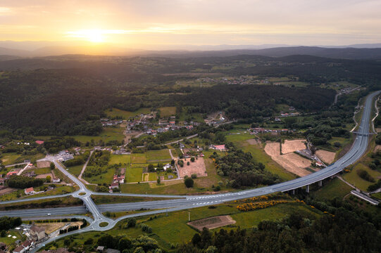 From above drone view of roads with exit points from main highway