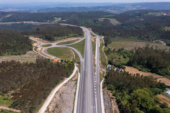 From above drone view of roads with exit points from main highway