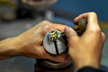 Jeweler's work on a gold item.