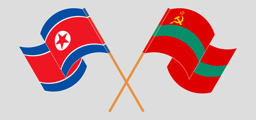Crossed and waving flags of North Korea and Transnistria