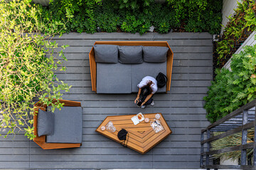 Birds eye view, a scene at local building exterior where people relax by sitting