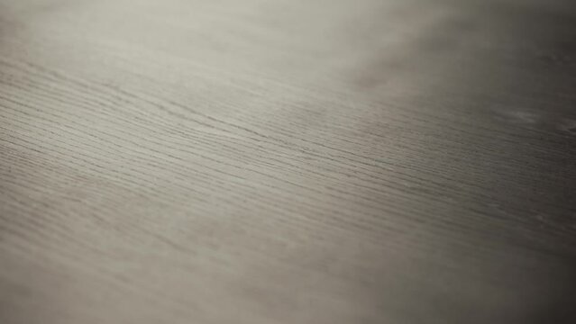 Film for vacuum decal on an MDF panel in a furniture production workshop. The film is stretched for the MDF panel. Film for MDF panels in the furniture industry.