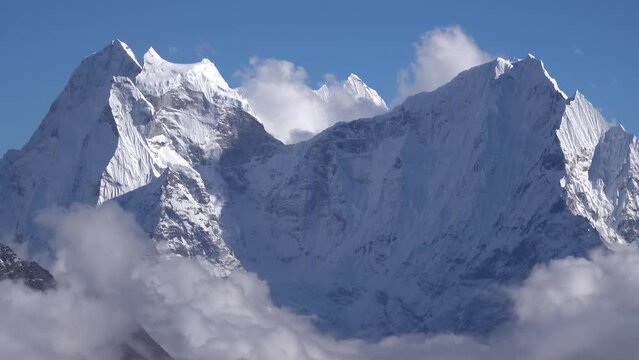 Himalaya mountain in clouds and blue sky with snow
Long shot view from Nepal, 2023
