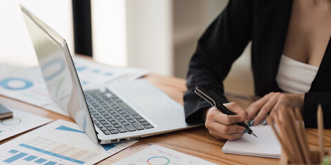 Accountant woman working on laptop and do document, tax, exchange, research, accounting and Financial advisor concept