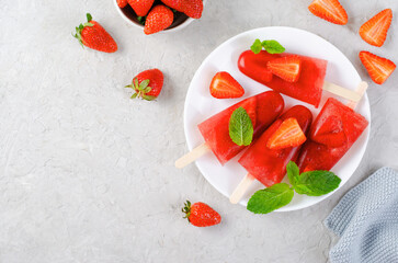 Refreshing Strawberry Popsicles, Ice Lolly with Fresh Strawberry and Mint on Bright Background