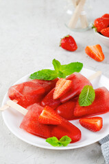 Refreshing Strawberry Popsicles, Ice Lolly with Fresh Strawberry and Mint on Bright Background