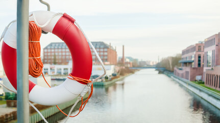 Coast security. Lifebuoy on the city embankment. For news of banner.