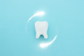 Protective vortex around tooth model on blue , teeth will good healthy.