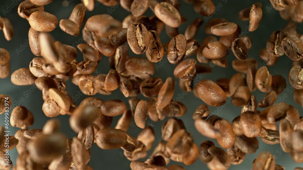 Poster super slow motion of rotating coffee beans on black background. filmed on high speed cinema camera, 
