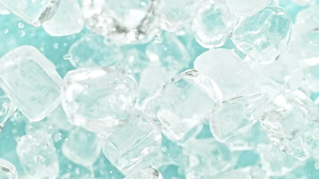 Super slow motion of rotating ice cubes, top view shot. Filmed on high speed cinema camera, 1000 fps, placed on high speed cine bot, following the object.