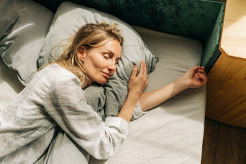 Young caucasian woman is sleeping. The concept of a healthy daytime sleep. - Powered by Adobe