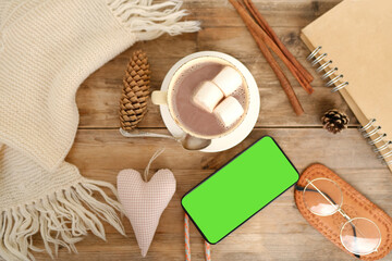 cup with drink coffee cappuccino, hot chocolate, marshmallows, garlands, winter clothes, caffeine improves functioning of human brain, stimulates nervous system, health benefits and harms, copy space