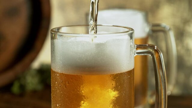 Super slow motion of pouring beer into pint in motion. Filmed on high speed cinema camera, 1000 fps. Camera placed on high speed cine bot.