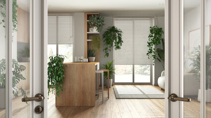 Classic white glass door opening on wooden kitchen and living room with sofa and many houseplants. Welcome home concept, urban jungle interior design idea