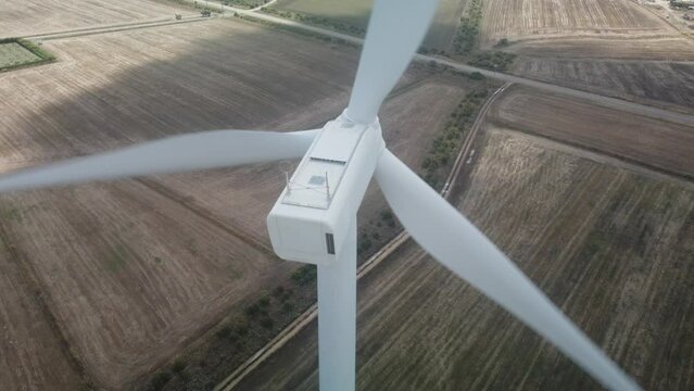 wind turbine in the foreground in the medio campidano wind farm in southern sardinia
