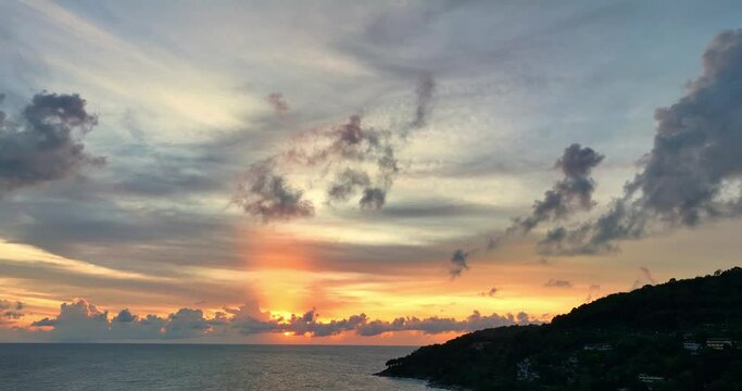 aerial view scenery sunset above the ocean colorful clouds cover the ocean..amazing sky in sunset at Karon beach Phuket Thailand. .Real amazing panoramic sunset sky with gentle colorful clouds..