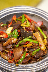 A delicious Chinese Xinjiang dish, stir-fried haggis with peppers