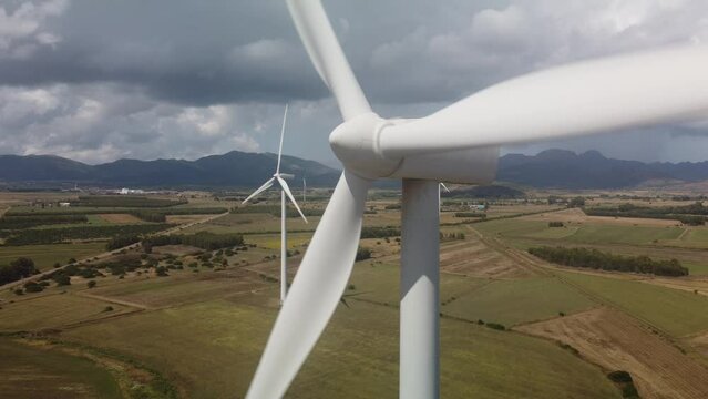 wind turbine in the foreground in the medio campidano wind farm in southern sardinia
