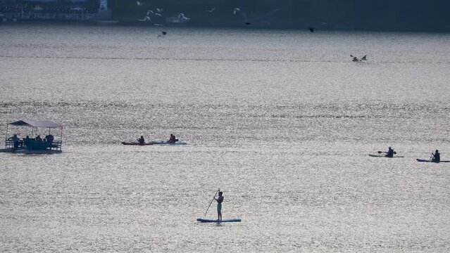 People in boats and standing boards on Pokhara lake
Long shot from Nepal, may, 17, 2023
