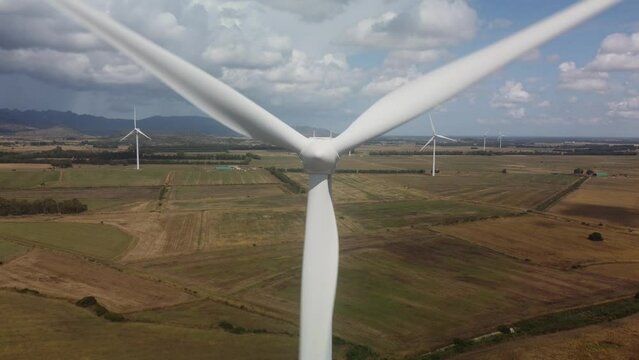 wind turbine in the foreground in the medio campidano wind farm in southern sardinia
