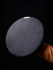 Man holding black sports soft round HEMA shield