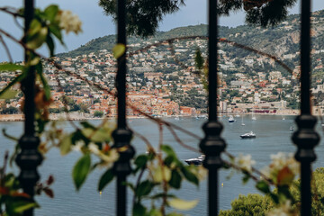 View through the fence of Villefranche-sur-Mer, from the peninsula of Saint-Jean-Cap-Ferrat