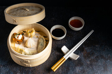 Dim sum steamed in a bamboo basket.