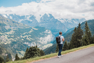 Fototapeta na wymiar Young man hiking in Switzerland mountains