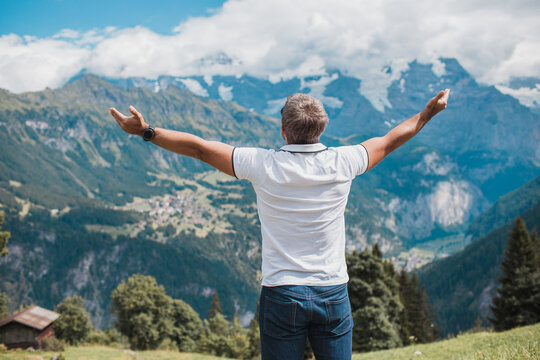 Young man hiking in Switzerland mountains