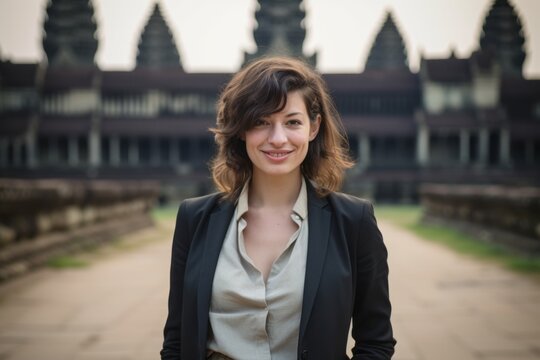 Portrait of a young businesswoman in front of Angkor Wat